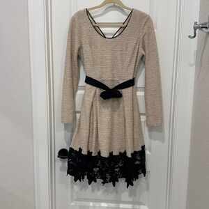 Medium. Ivory and black dress.  Lace. Belt with flower.  Very nice.